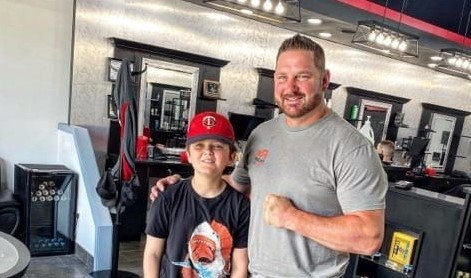 Corey Allen with a young hockey fan